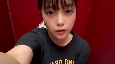 A plain girl college coed wanks in the men's shower at a karaoke bar, stinkin' the scent of men's shafts and pee.