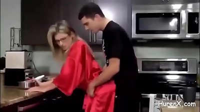 pound with blond cougar in kitchen